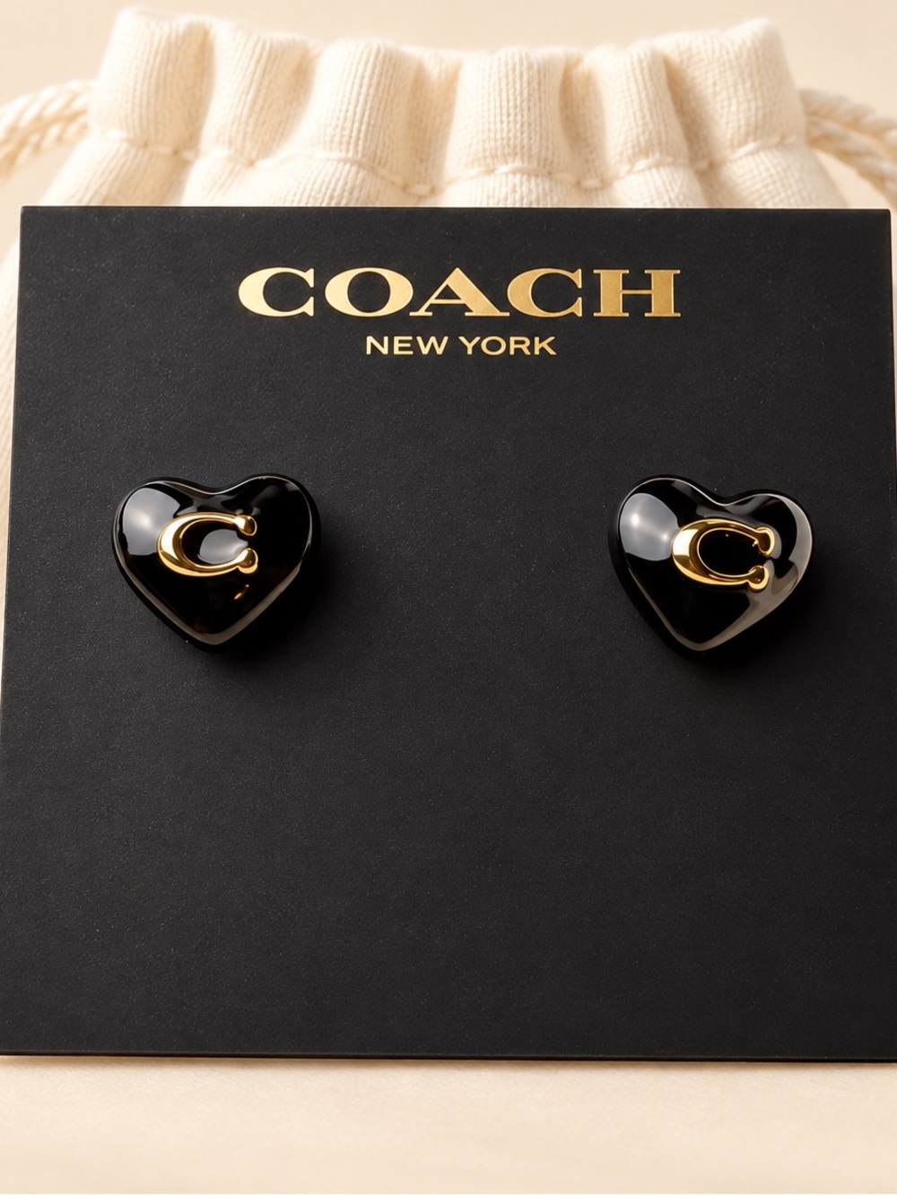 COACH Black Heart Stud Earrings with Gold 'C' Accent